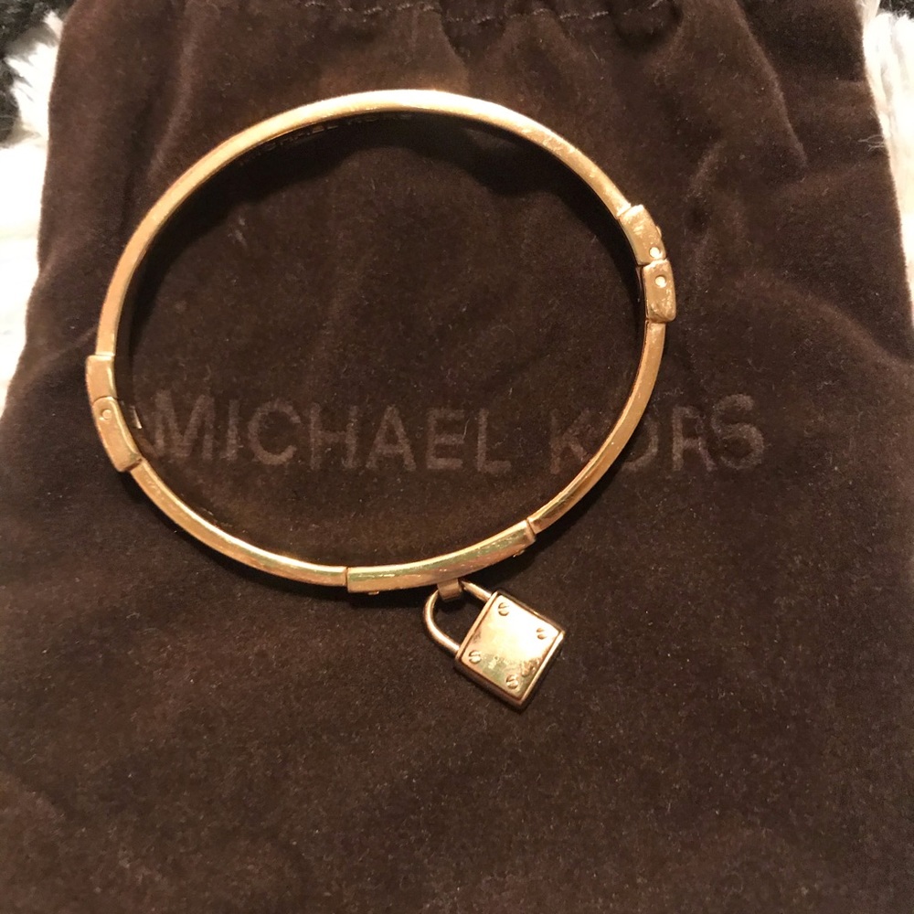 Michael Kors gold lock bracelet with diamonds.